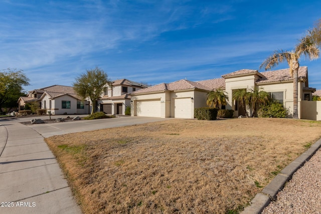 view of front facade with a garage and a front lawn