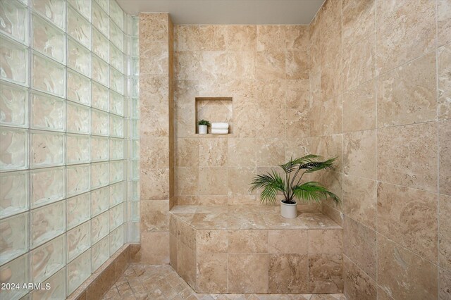 bathroom featuring tiled shower