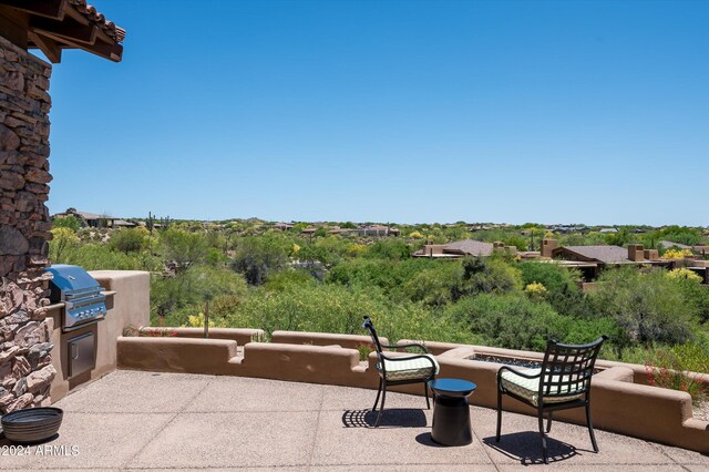 view of patio with exterior kitchen and grilling area