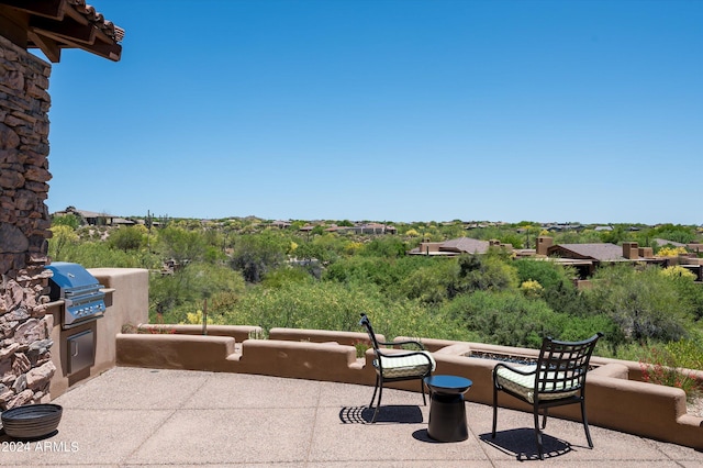 view of patio with a grill and area for grilling