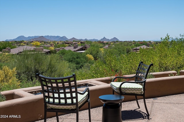 balcony with a patio and a mountain view