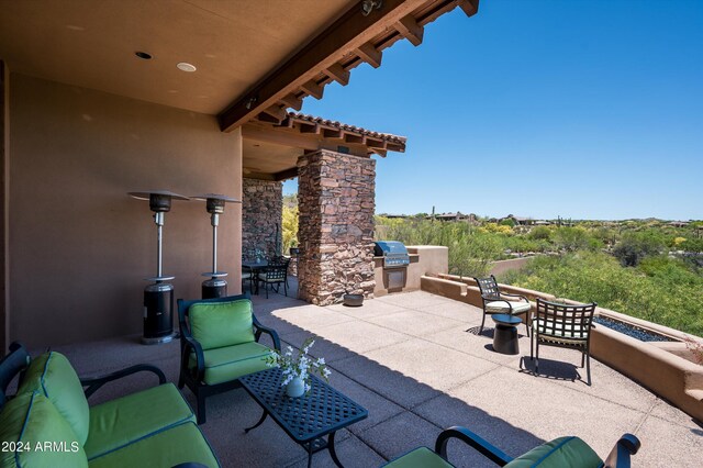 view of patio with a grill and an outdoor kitchen