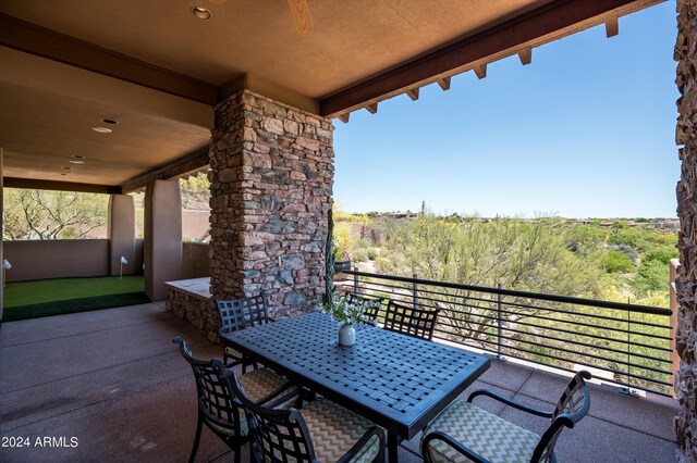 view of patio featuring a balcony