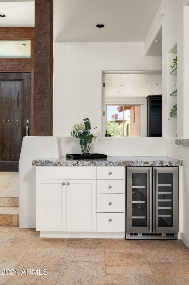 bathroom with tile flooring and beverage cooler