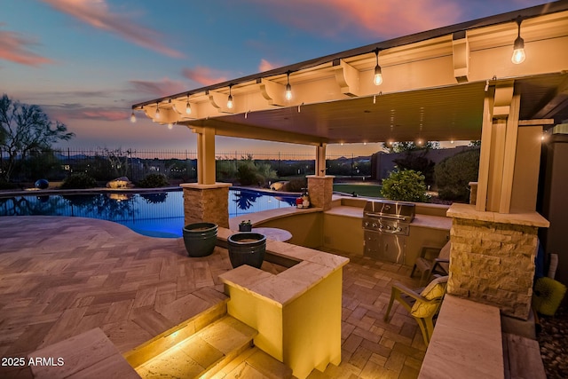 31108 N 122nd Ln, Peoria, AZ 85383 - view of pool featuring exterior kitchen, a patio area, area for grilling, and fence