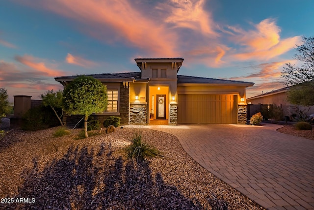 31108 N 122nd Ln, Peoria, AZ 85383 - prairie-style home featuring stone siding, decorative driveway, a garage, and stucco siding