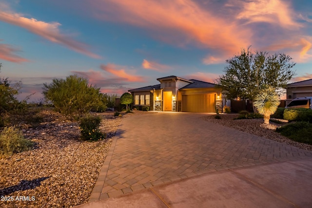 31108 N 122nd Ln, Peoria, AZ 85383 - view of front of property with a garage, decorative driveway, and stucco siding