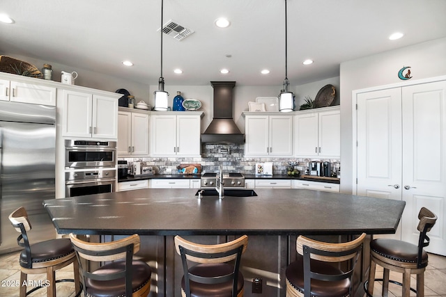 31108 N 122nd Ln, Peoria, AZ 85383 - kitchen featuring stainless steel appliances, dark countertops, a sink, premium range hood, and white cabinetry