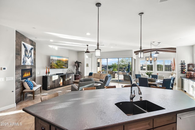 31108 N 122nd Ln, Peoria, AZ 85383 - kitchen with a sink, a ceiling fan, open floor plan, a large fireplace, and recessed lighting