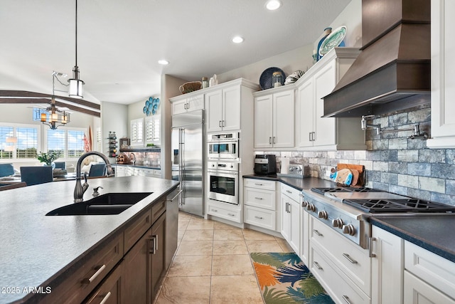 31108 N 122nd Ln, Peoria, AZ 85383 - kitchen featuring a sink, appliances with stainless steel finishes, custom exhaust hood, white cabinets, and tasteful backsplash