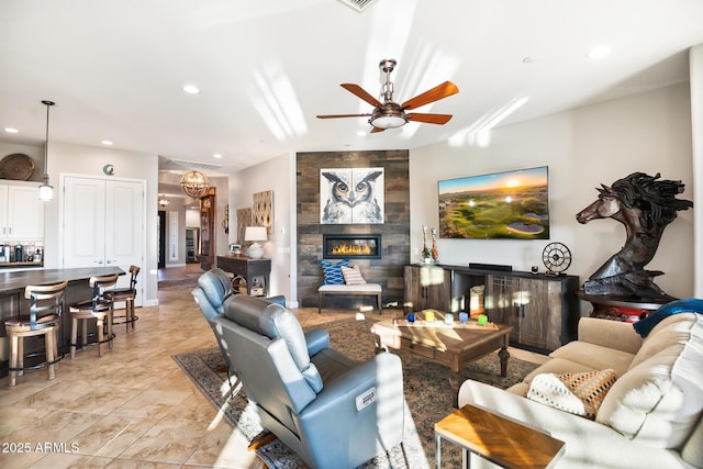 31108 N 122nd Ln, Peoria, AZ 85383 - living room with a ceiling fan, a fireplace, and recessed lighting