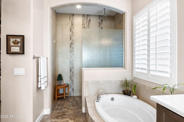 31108 N 122nd Ln, Peoria, AZ 85383 - bathroom featuring a bath, tiled shower, vanity, and baseboards