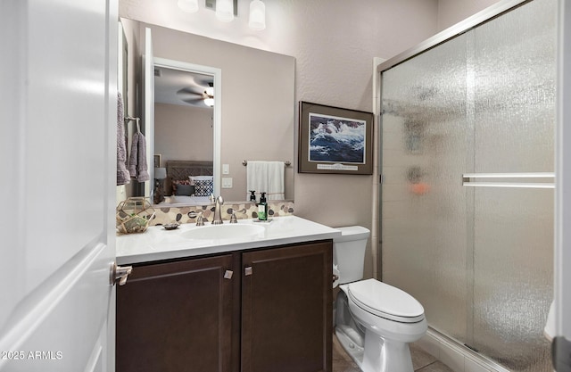 31108 N 122nd Ln, Peoria, AZ 85383 - ensuite bathroom with a stall shower, vanity, toilet, and a ceiling fan