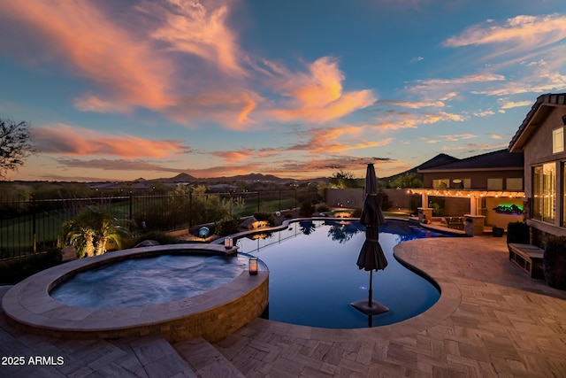 31108 N 122nd Ln, Peoria, AZ 85383 - view of pool featuring a fenced backyard, a patio area, and a pool with connected hot tub