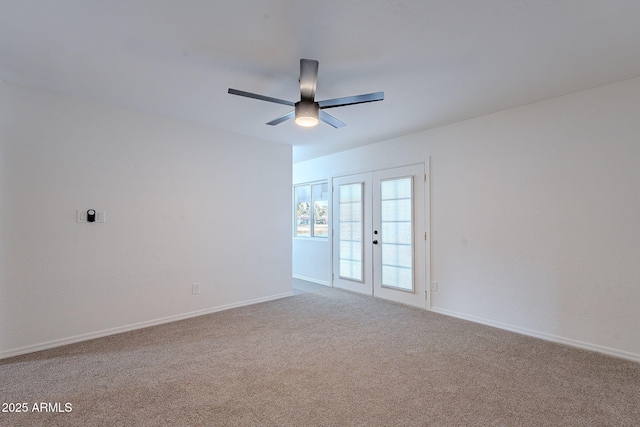 unfurnished room featuring french doors, ceiling fan, and carpet flooring