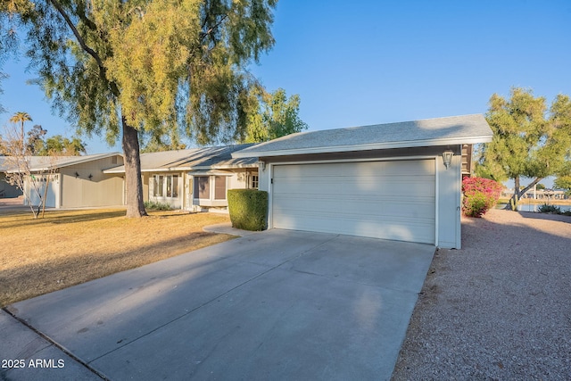 ranch-style house featuring a garage