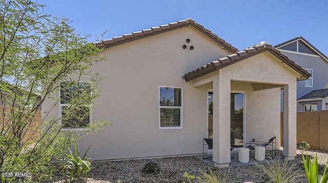 9621 W Monterey Way, Phoenix, AZ 85037 - back of property featuring stucco siding, a patio, and a tiled roof