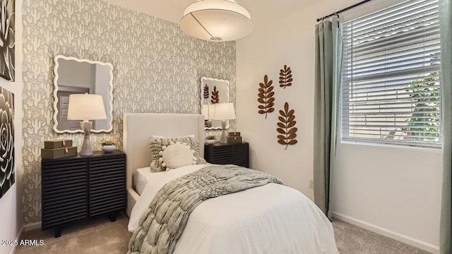 9621 W Monterey Way, Phoenix, AZ 85037 - bedroom with carpet flooring, multiple windows, and wallpapered walls