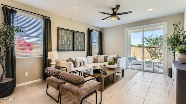 9621 W Monterey Way, Phoenix, AZ 85037 - living room with plenty of natural light, a ceiling fan, light tile patterned floors, and recessed lighting