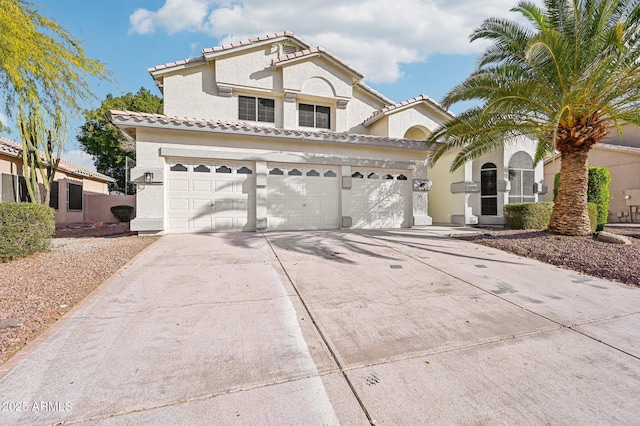 mediterranean / spanish-style home featuring a garage