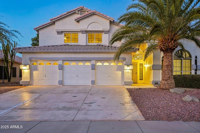 mediterranean / spanish house with a garage