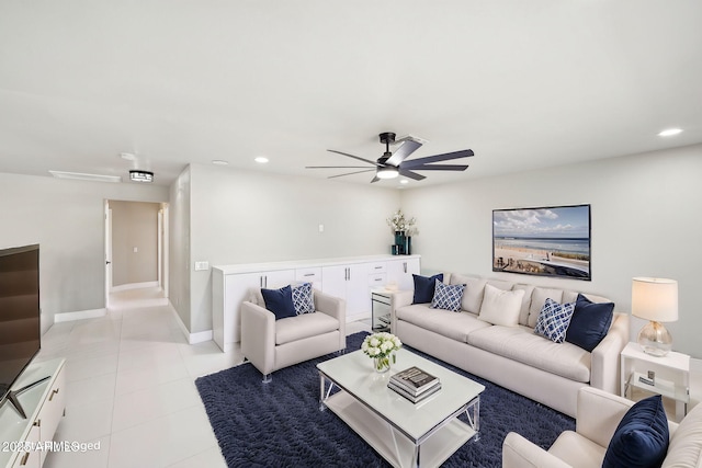 living room with ceiling fan and light tile patterned floors