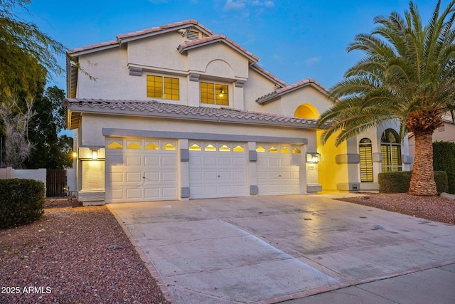 mediterranean / spanish-style home featuring a garage