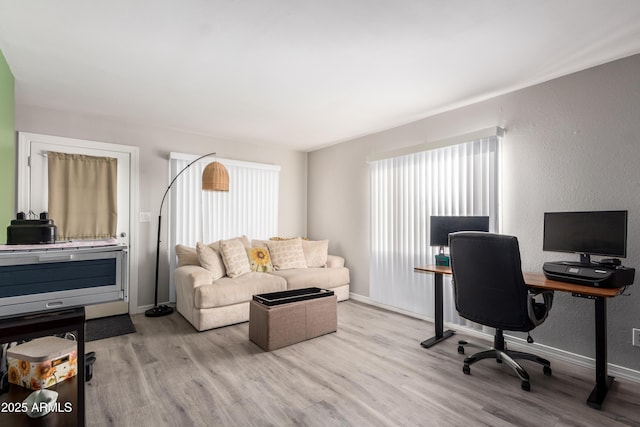 office space featuring light wood-type flooring