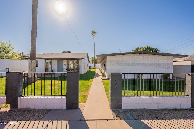 bungalow-style house featuring covered porch and a front lawn