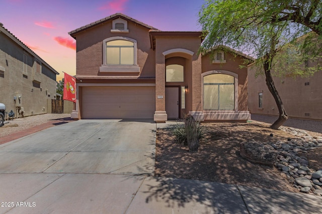 7725 S 47th Ln, Laveen, AZ 85339 - mediterranean / spanish home with a garage, concrete driveway, stucco siding, and a tiled roof