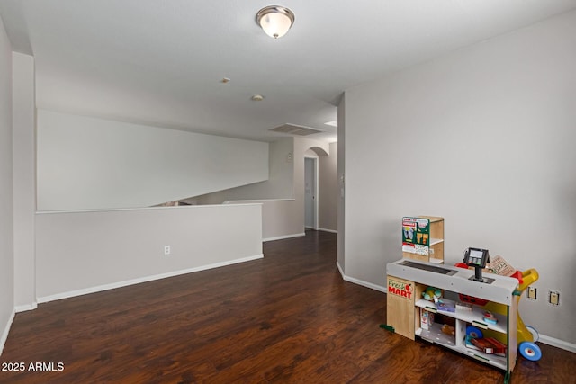 7725 S 47th Ln, Laveen, AZ 85339 - empty room featuring arched walkways and wood finished floors