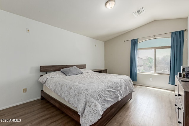 7725 S 47th Ln, Laveen, AZ 85339 - bedroom featuring wood finished floors and lofted ceiling