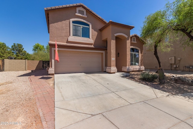 7725 S 47th Ln, Laveen, AZ 85339 - mediterranean / spanish home featuring driveway, an attached garage, and stucco siding