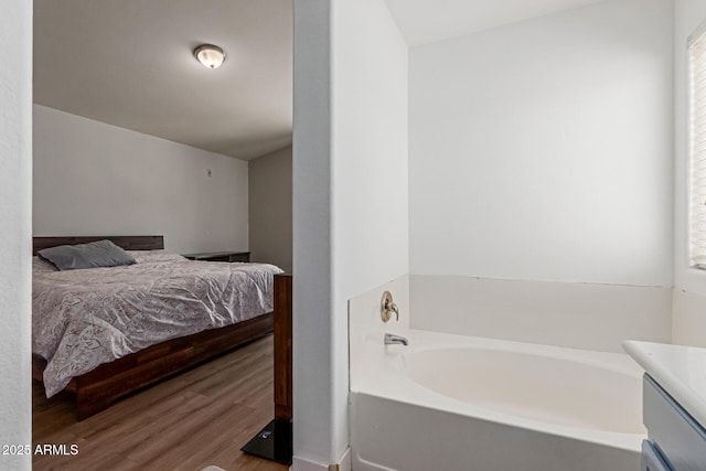 7725 S 47th Ln, Laveen, AZ 85339 - full bathroom with ensuite bathroom, a garden tub, wood finished floors, and vanity