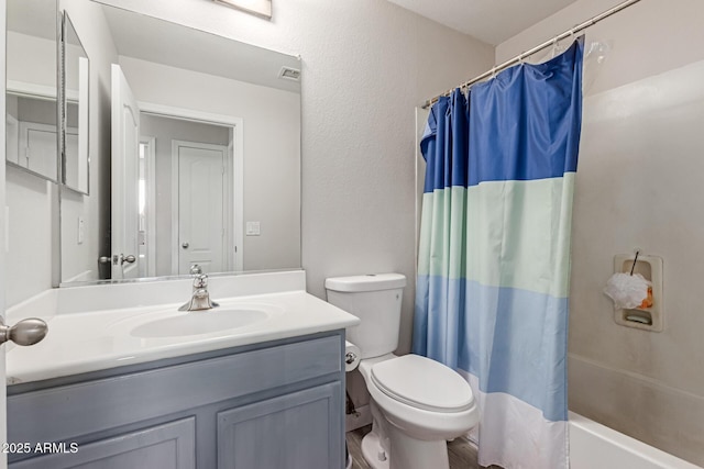 7725 S 47th Ln, Laveen, AZ 85339 - bathroom with vanity and shower / bath combo with shower curtain