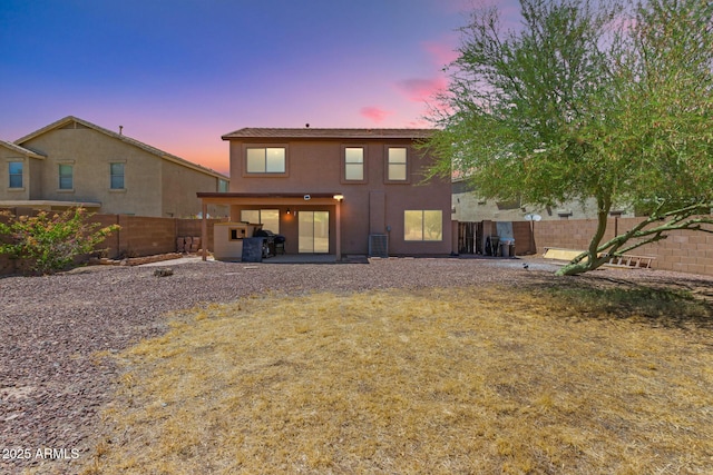 7725 S 47th Ln, Laveen, AZ 85339 - rear view of property with stucco siding, a fenced backyard, and a patio area