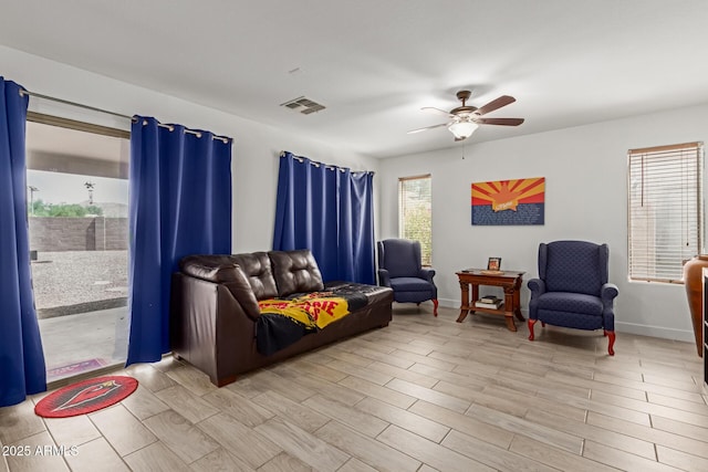 7725 S 47th Ln, Laveen, AZ 85339 - living room featuring ceiling fan and light wood finished floors
