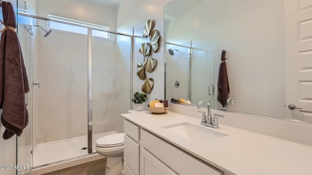 23244 W Tamarisk Ave, Buckeye, AZ 85326 - bathroom featuring vanity, a stall shower, and wood finished floors