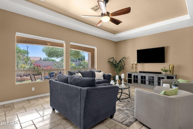 5342 S Citrus Ct, Gilbert, AZ 85298 - living room with a ceiling fan, a tray ceiling, and baseboards