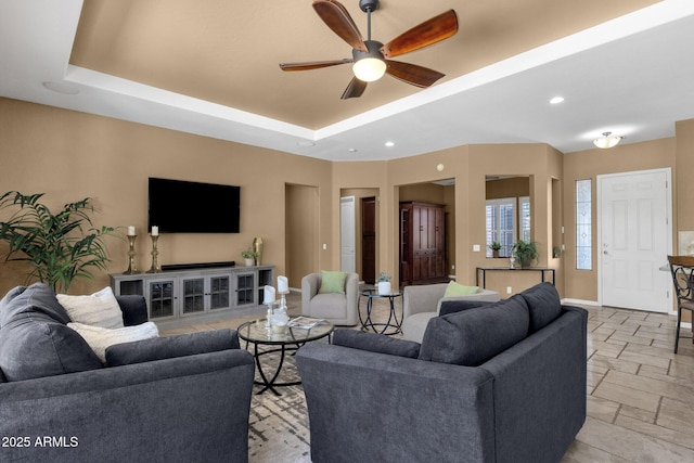5342 S Citrus Ct, Gilbert, AZ 85298 - living area featuring baseboards, a ceiling fan, a raised ceiling, stone tile floors, and recessed lighting