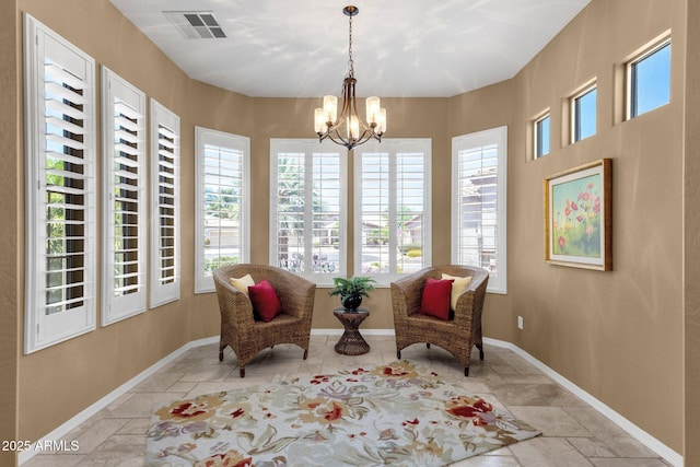 5342 S Citrus Ct, Gilbert, AZ 85298 - living area featuring stone tile flooring, a chandelier, and baseboards