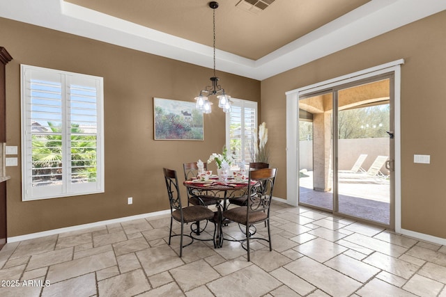 5342 S Citrus Ct, Gilbert, AZ 85298 - dining room featuring baseboards, a raised ceiling, a chandelier, and light stone finish flooring