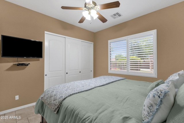 5342 S Citrus Ct, Gilbert, AZ 85298 - bedroom with a closet, baseboards, a ceiling fan, and light tile patterned floors