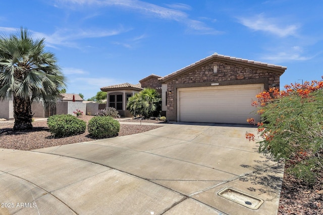 5342 S Citrus Ct, Gilbert, AZ 85298 - view of front of house with driveway, a garage, a tile roof, and stone siding