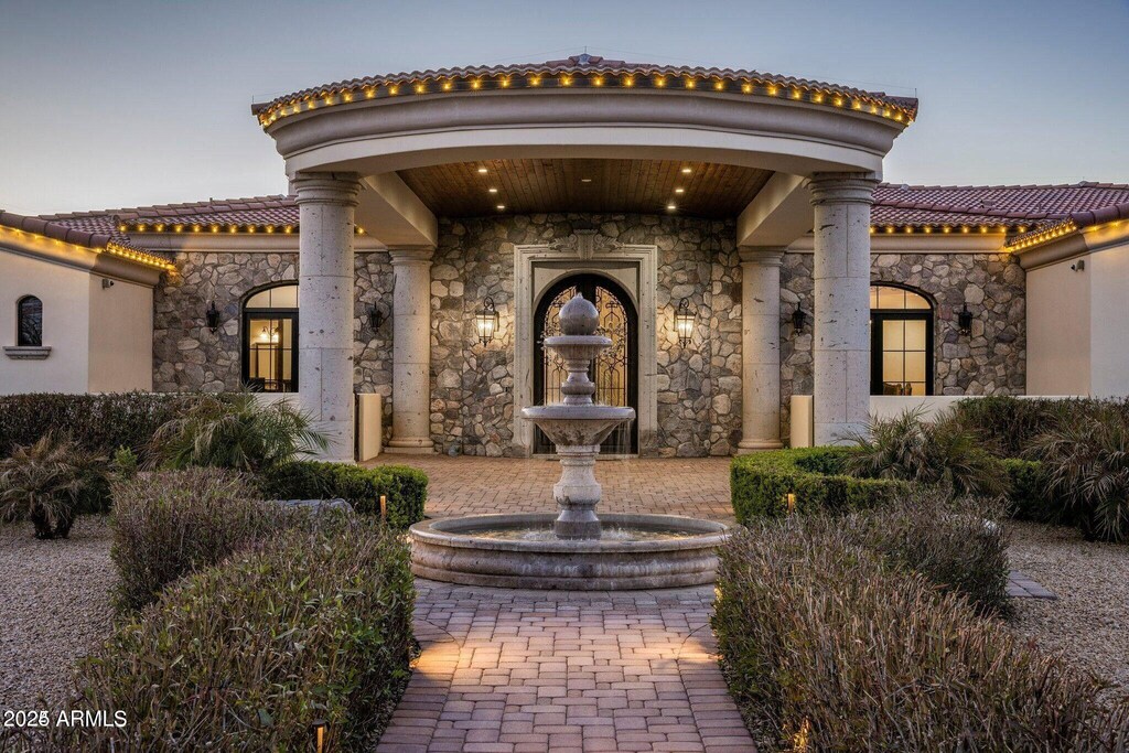 property entrance with a tile roof