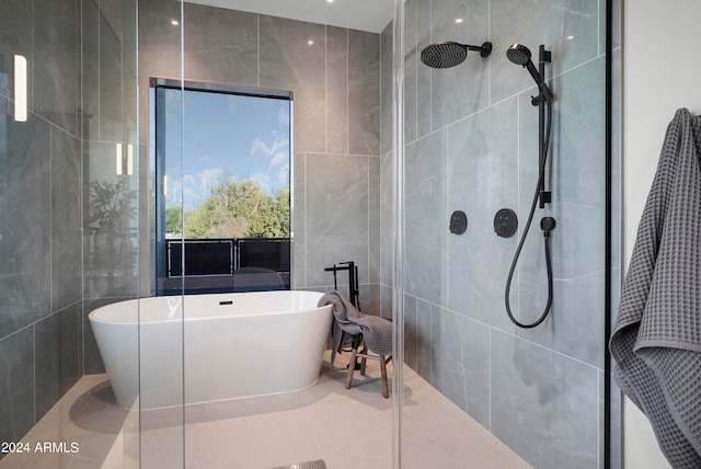 bathroom featuring tile walls, tile patterned flooring, and independent shower and bath