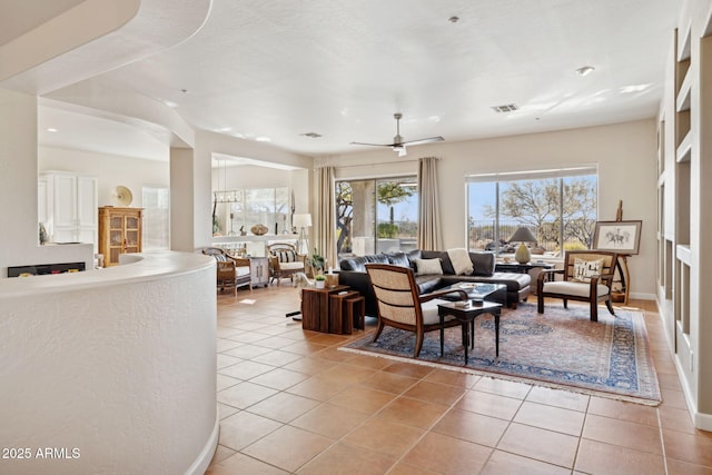 living room with light tile patterned flooring and ceiling fan