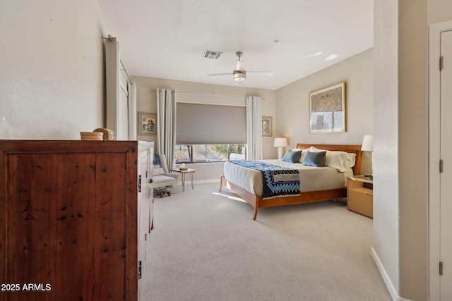 bedroom with light carpet and ceiling fan