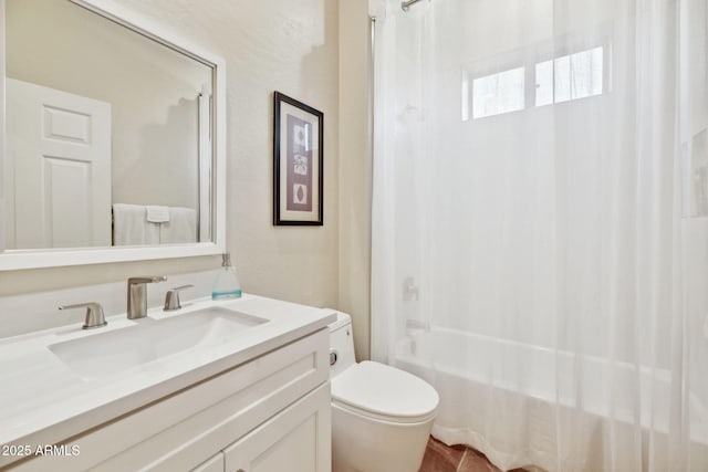 full bathroom with toilet, vanity, and shower / bath combo with shower curtain