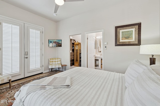 bedroom featuring a spacious closet, ensuite bath, and ceiling fan